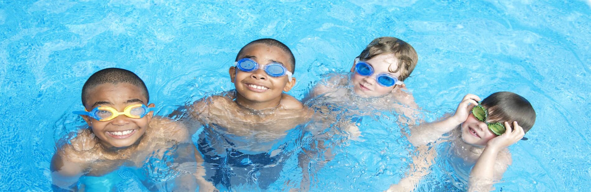 Four children in swimming pool