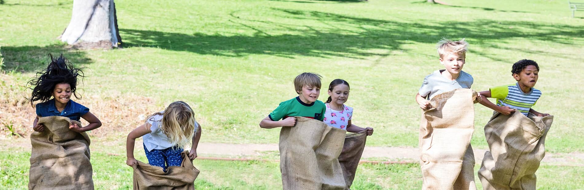 Group of children in potato sack race